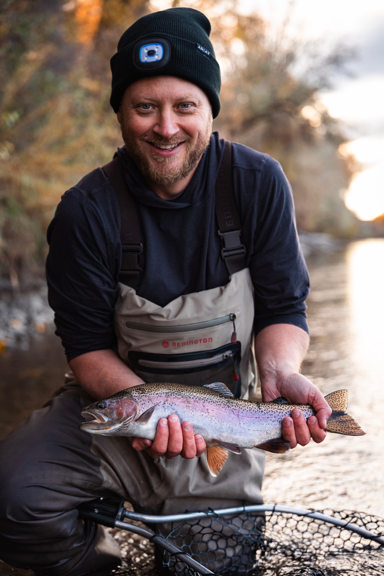 Mark Richardson holding a Rainbow Trout